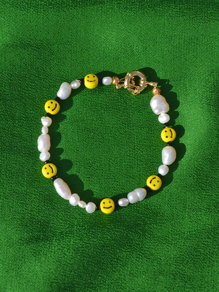 Mr. Happy the Classic Bracelet: Smaller freshwater pearls, black acrylic beads and smiley face vintage looking beads.