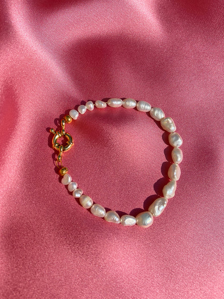 Dionne's Bracelet: Keshi freshwater pearl bracelet in ascending sizes: Larger pearls at the front of the bracelet and smaller towards the end. Symmetrical design.