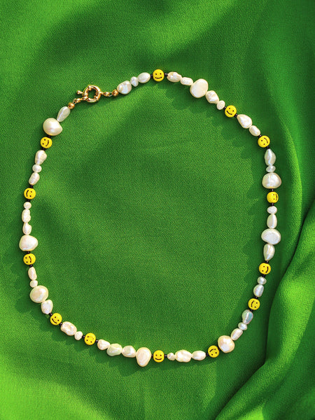 Mr. Happy the Classic Necklace: Mix of smaller freshwater pearls, black acrylic beads and smiley face vintage looking beads.